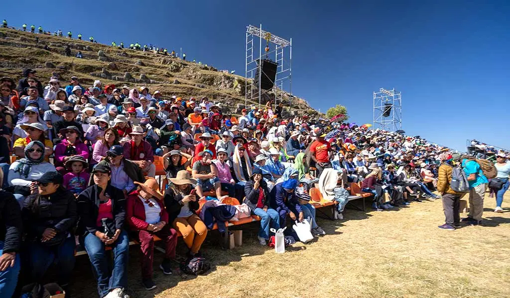 Spectators seated in Inti Raymi tribune watching the ceremony